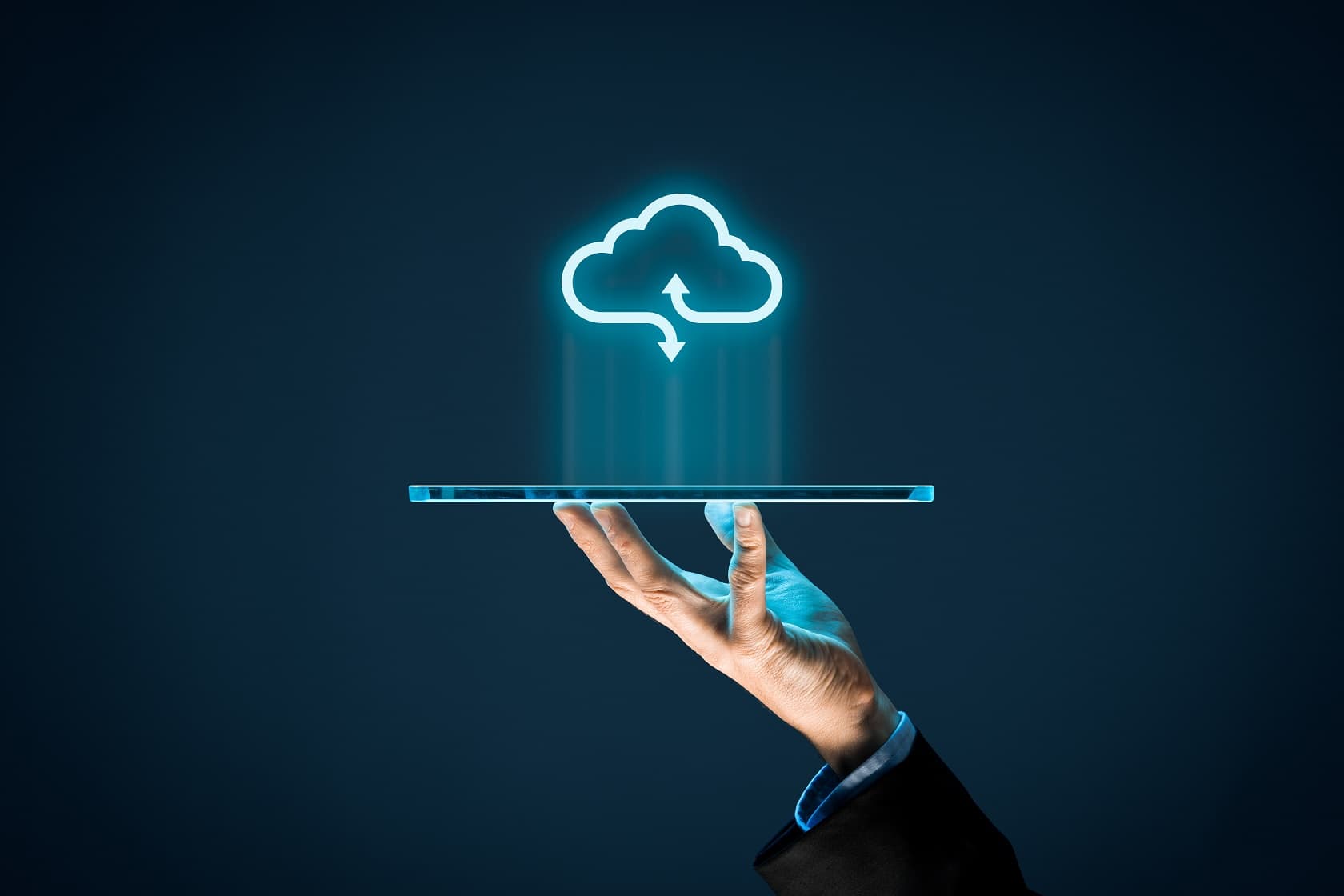 Cloud computing concept - connect devices to cloud. Businessman or information technologist with cloud computing icon and tablet. Overview of Cloud Computing